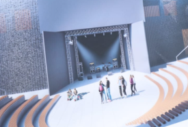 Wizualizacja planowanej rozbudowy Filii nr 1 Młodzieżowego Domu Kultury w Opolu. Przedstawiono nowoczesną przestrzeń plenerową z dużą sceną, schodami i amfiteatralnymi miejscami do siedzenia oraz grupami młodzieży.