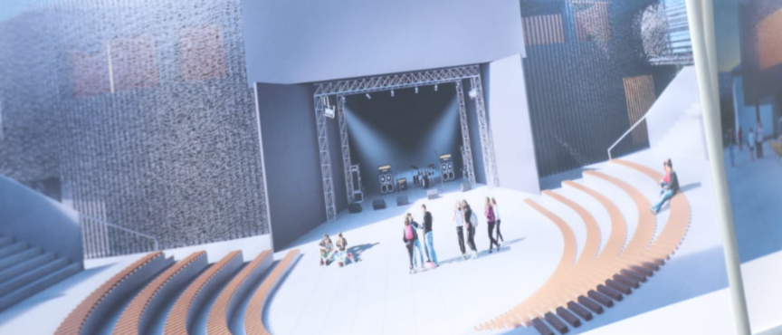 Wizualizacja planowanej rozbudowy Filii nr 1 Młodzieżowego Domu Kultury w Opolu. Przedstawiono nowoczesną przestrzeń plenerową z dużą sceną, schodami i amfiteatralnymi miejscami do siedzenia oraz grupami młodzieży.